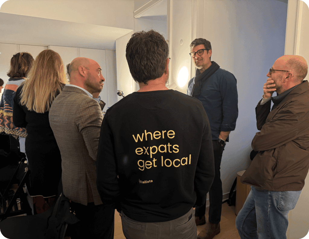Expats wearing 'where expats get local' shirts