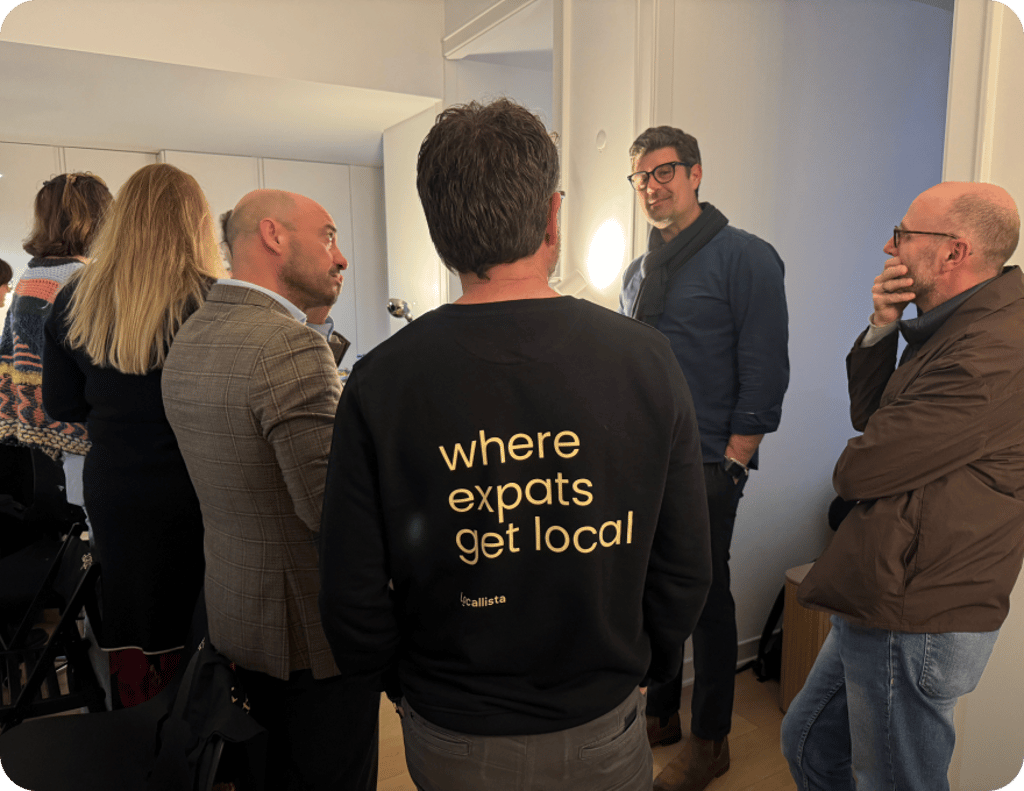 Expats wearing 'where expats get local' shirts